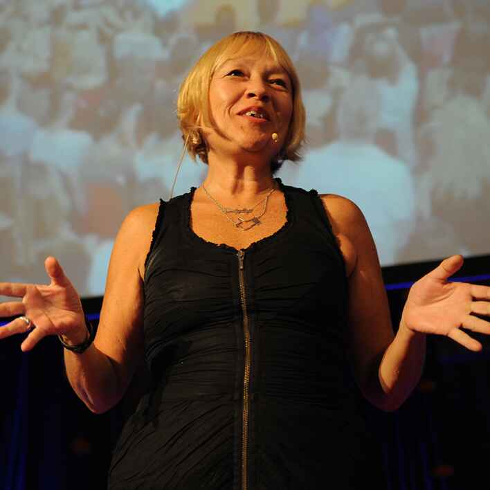 Cindy Gallop holding a dollar bill with the words 